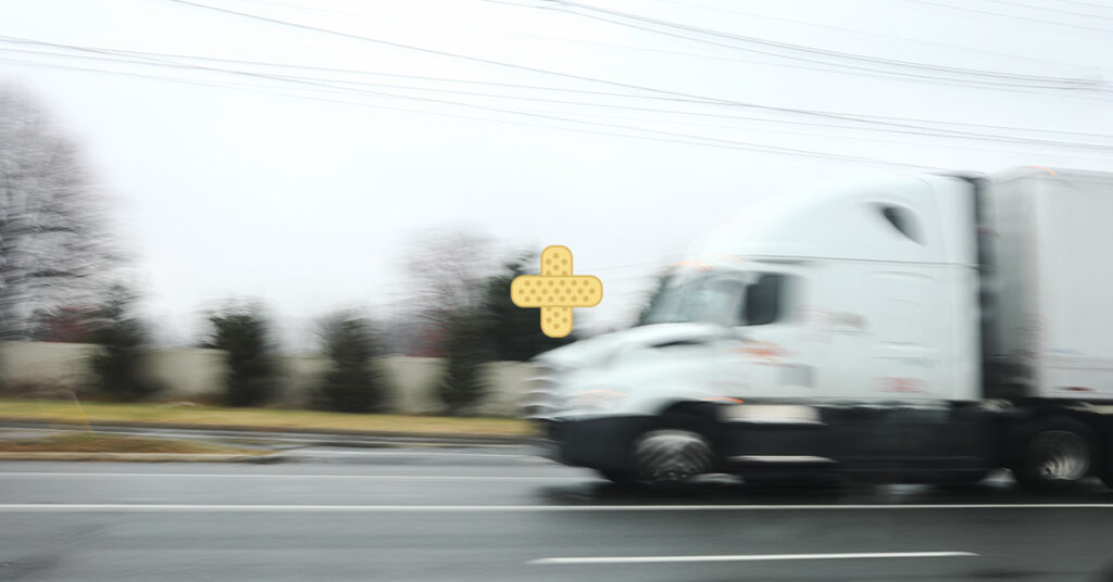 image of truck driving on road for work-related injury blog post