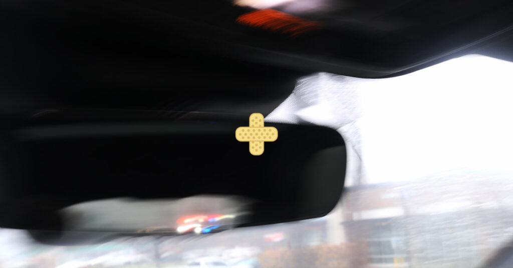 rearview mirror view of NJ emergency vehicles